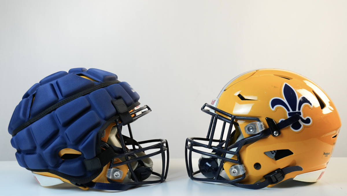 Guardian Caps are foam shields strapped on top of a standard helmet that reduces head injuries up to 25%.  is year they are offered for the
football team in practices and games but not mandatory. Coach Brian Kells will eventually make the shield mandatory for the players to wear.